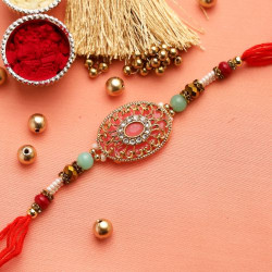 Golden Filigree work Jewelled Rakhi with Red and White Beads