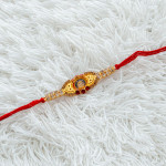 AD Embellished with Ganeshji Rakhi