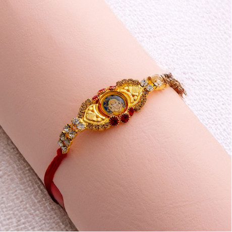 AD Embellished with Ganeshji Rakhi