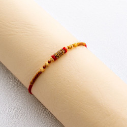 Beaded AD Charms Rakhi for Auspicious Tying Beaded AD Charms Rakhi for Auspicious Tying