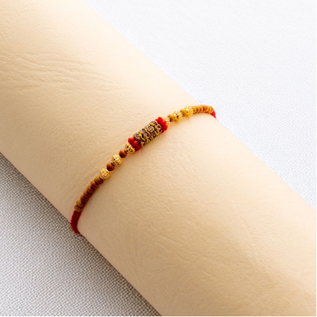 Beaded AD Charms Rakhi for Auspicious Tying Beaded AD Charms Rakhi for Auspicious Tying