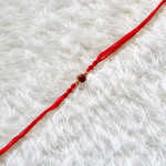 Blessed Rudraksh Rakhi with Wooden Beads Blessed Rudraksh Rakhi with Wooden Beads