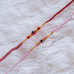 Chic Pair of Evil Eye Rakhis with Pearls and Beads