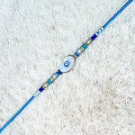 Designer Evil Eye Rakhi with Blue Beads Designer Evil Eye Rakhi with Blue Beads