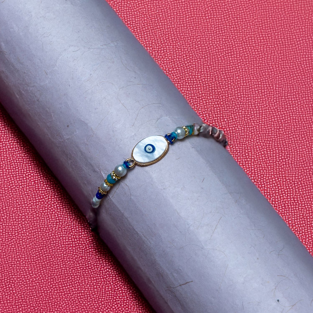 Designer Evil Eye Rakhi with Blue Beads Designer Evil Eye Rakhi with Blue Beads