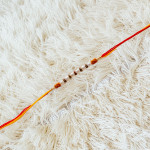 Designer Pearl Rakhi with Beads