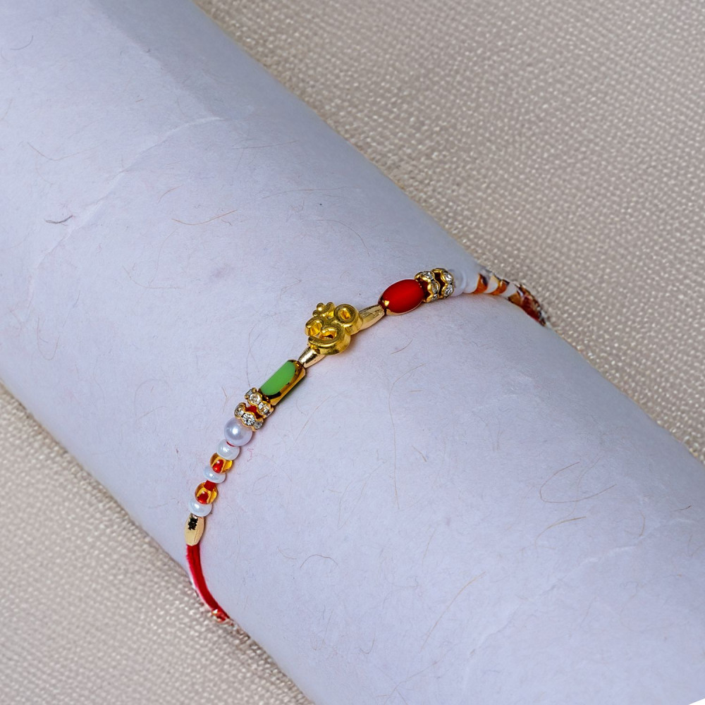 Divine Om Symbol Rakhi - Auspicious Thread for Bhaiya Divine Om Symbol Rakhi - Auspicious Thread for Bhaiya
