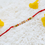 Double Line AD Pearls and Beads Rakhi Double Line AD Pearls and Beads Rakhi