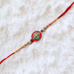 Elegant Enamel Rakhi with Sparkling Diamonds Elegant Enamel Rakhi with Sparkling Diamonds