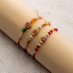 Elegant Trio of OM Rakhis with Colorful Beads