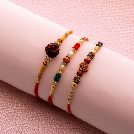 Elegant Trio of Rakhis with Pearls, Rudraksh, and OM