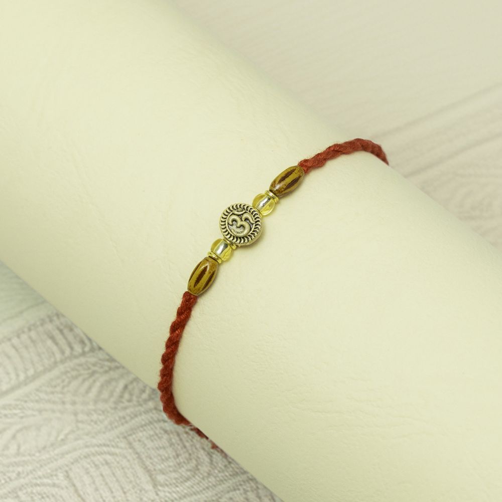 Festive OM Rakhi for Raksha Bandhan Festive OM Rakhi for Raksha Bandhan