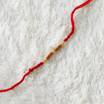 Golden Beads with Fancy Stones Studded Rakhi