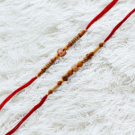 Graceful Duo of Rakhis with Beads and Pearls Graceful Duo of Rakhis with Beads and Pearls