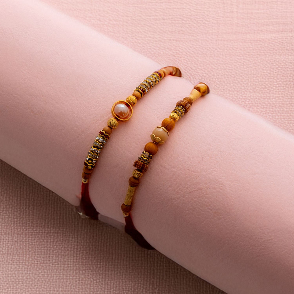 Graceful Duo of Rakhis with Beads and Pearls Graceful Duo of Rakhis with Beads and Pearls