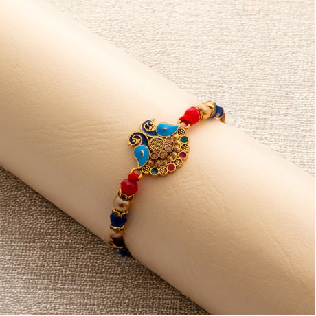 Handcrafted Diamond Rakhi with Enamel Peacock Details