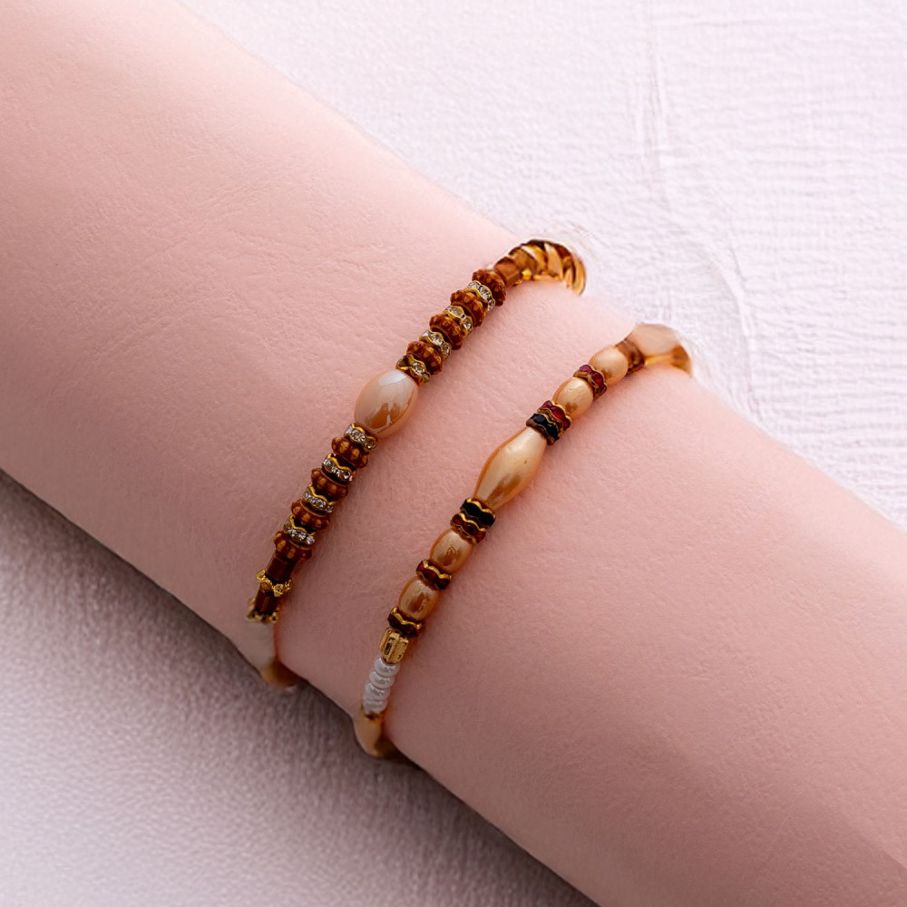 Handcrafted Set of 2 Rakhis with Pearls and Beads Handcrafted Set of 2 Rakhis with Pearls and Beads