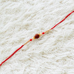 Handmade Rudraksh Rakhi with Beaded Pattern Handmade Rudraksh Rakhi with Beaded Pattern