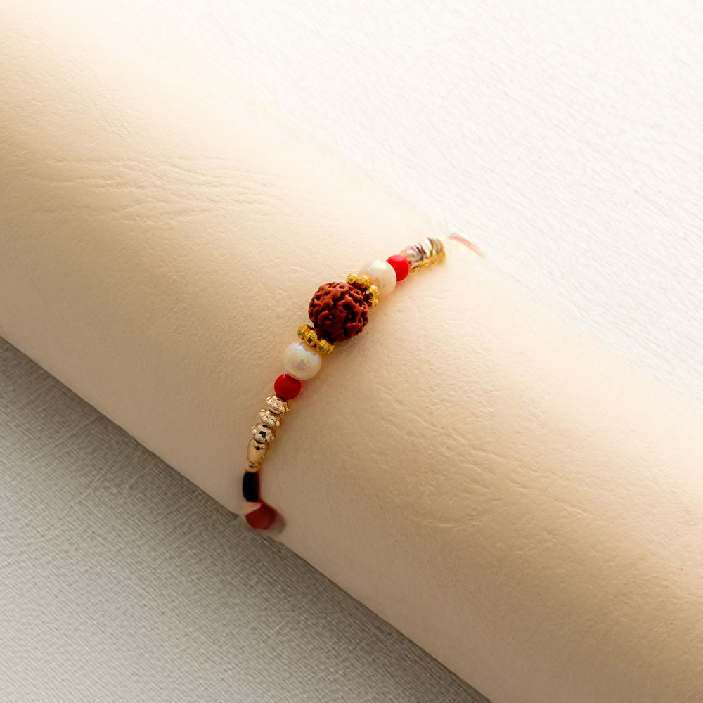 Handmade Rudraksh Rakhi with Beaded Pattern Handmade Rudraksh Rakhi with Beaded Pattern