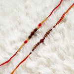 Intricately Designed Duo of Rakhis with Rudraksh and AD Intricately Designed Duo of Rakhis with Rudraksh and AD