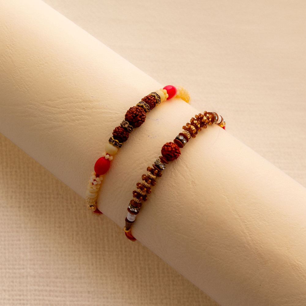 Intricately Designed Duo of Rakhis with Rudraksh and AD Intricately Designed Duo of Rakhis with Rudraksh and AD