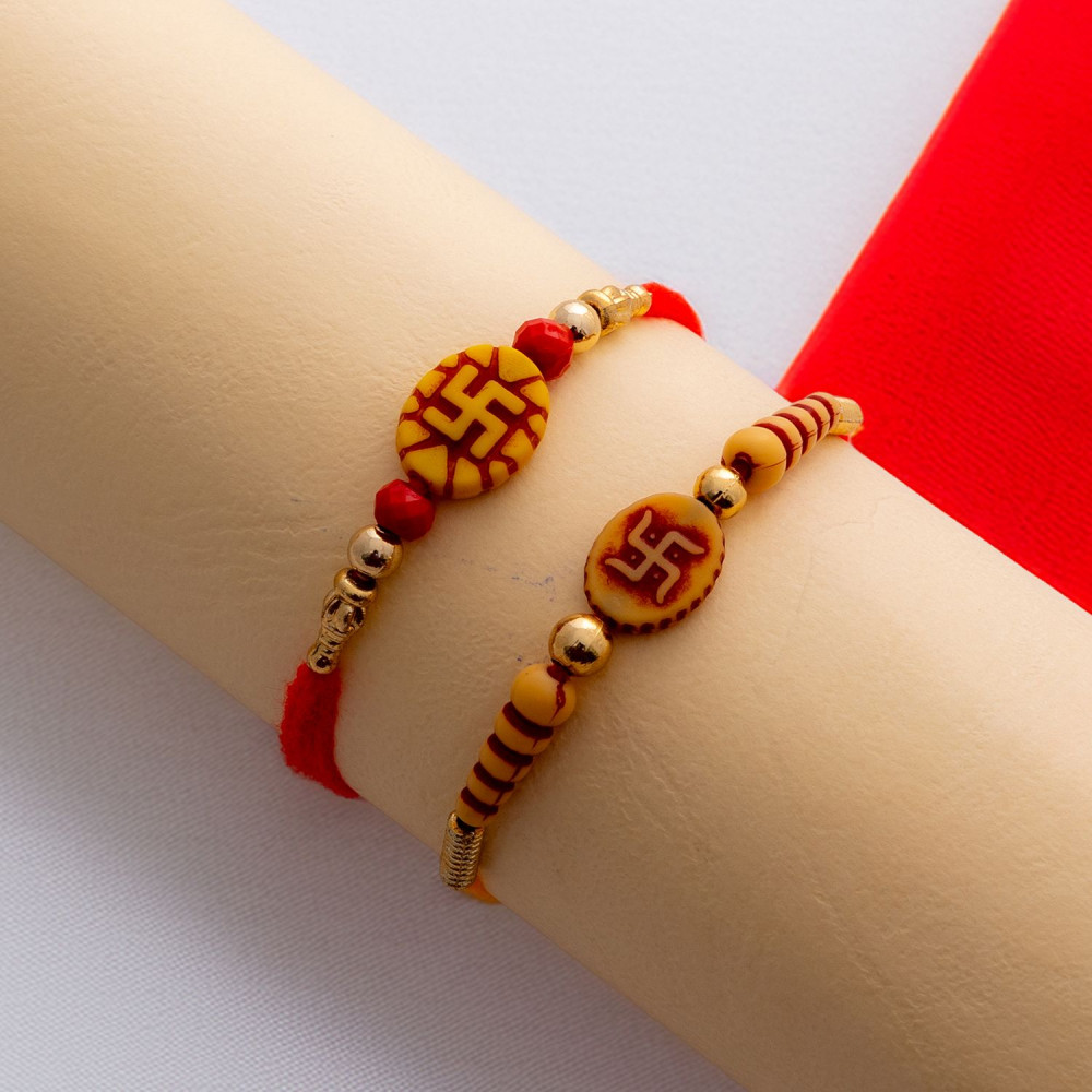 Lovely Set of 2 Rakhis with Swastik Motif Lovely Set of 2 Rakhis with Swastik Motif