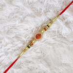 Lustrous OM Pearls Rakhi