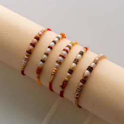 Luxurious Set of 5 Pearls Rakhis with American Diamonds