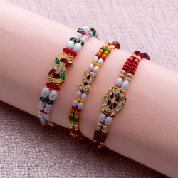 Luxurious Trio of Rakhis with American Diamonds and Beads Luxurious Trio of Rakhis with American Diamonds and Beads