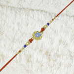 Luxury Enamel Rakhi with Antique Gold Charm Luxury Enamel Rakhi with Antique Gold Charm