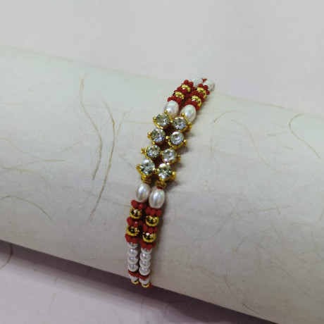 Marvelous Pearls AD and Beads Rakhi Marvelous Pearls AD and Beads Rakhi