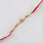 OM with Pearls and Beads Rakhi OM with Pearls and Beads Rakhi