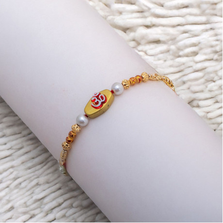 OM with Pearls and Beads Rakhi OM with Pearls and Beads Rakhi
