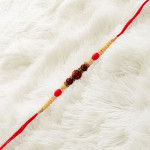 Pearls and Red Beads Work Triple Rudraksha Rakhi