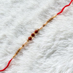 Pearls with Triple Rudraksha Traditional Rakhi Pearls with Triple Rudraksha Traditional Rakhi