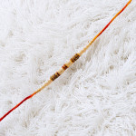 Refined Pearl Rakhi with Diamond Design