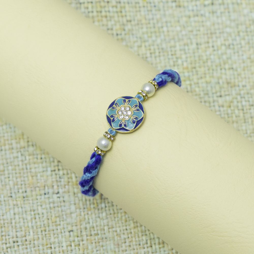 Royal Blue Rakhi with Elegant Pearls Embellishments Royal Blue Rakhi with Elegant Pearls Embellishments