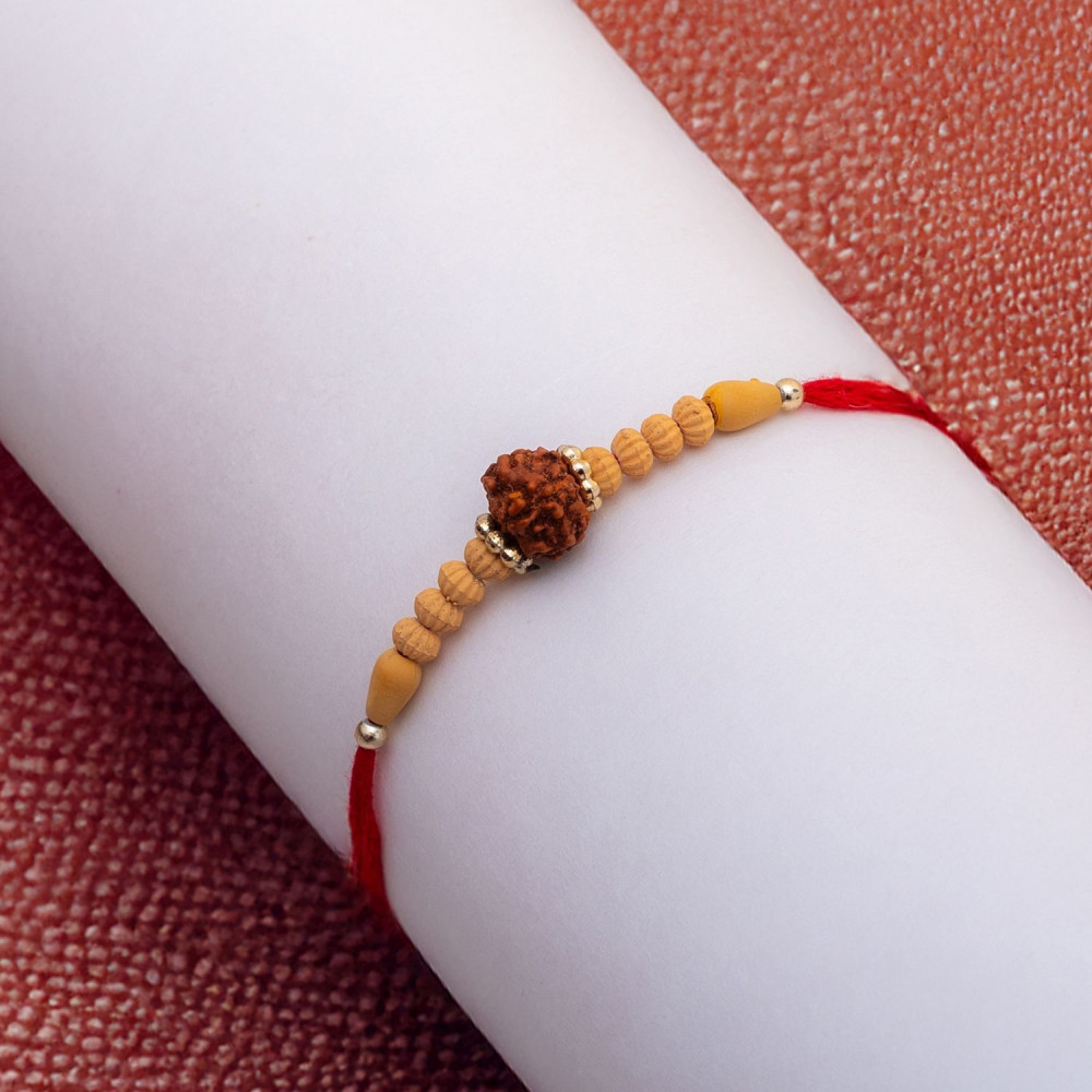 Rudraksh and Beads Studded Rakhi Rudraksh and Beads Studded Rakhi