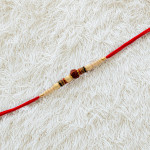 Rudraksh with Pearls, Colorful AD and Beads Rakhi Rudraksh with Pearls, Colorful AD and Beads Rakhi