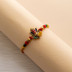 Sacred Ganesha Rakhi with Beads Highlights