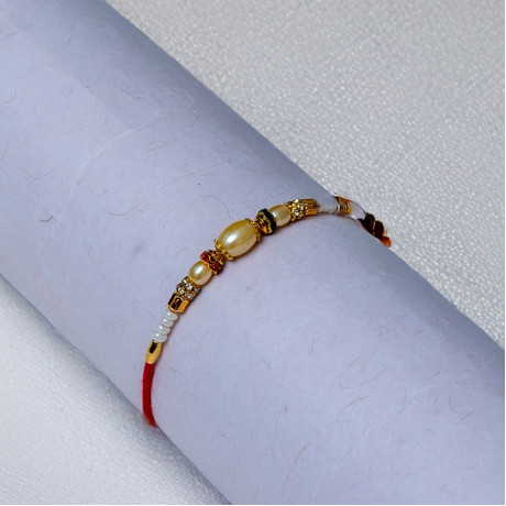 Serene Bond Pearl Thread Rakhi