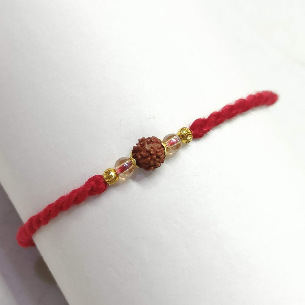 Single Rudraksh Rakhi with Beaded Pattern Single Rudraksh Rakhi with Beaded Pattern