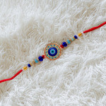 Sophisticated Evil Eye Enamel Rakhi with Colorful Beads