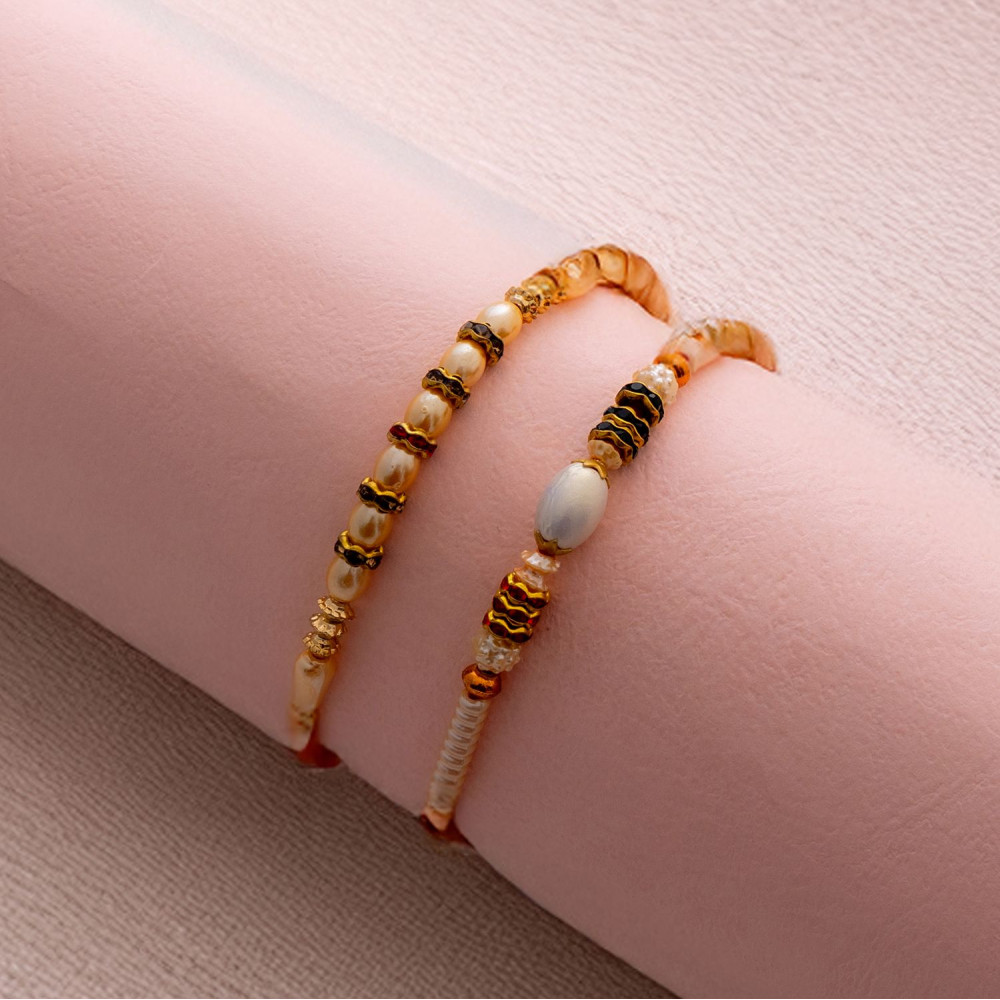 Sophisticated Pair of Rakhis with Pearls Sophisticated Pair of Rakhis with Pearls