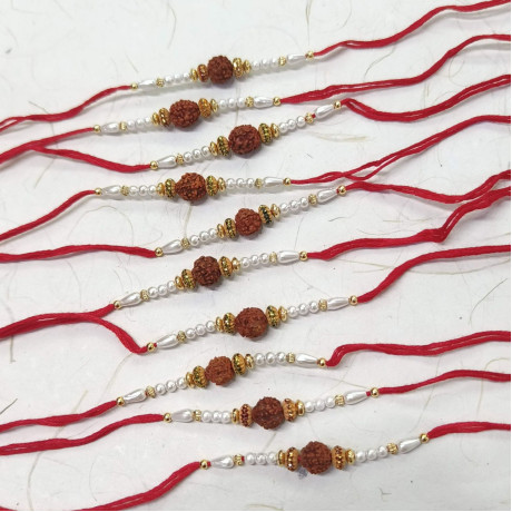 Sophisticated Set of 10 Rakhis with Rudraksh and Pearls Sophisticated Set of 10 Rakhis with Rudraksh and Pearls