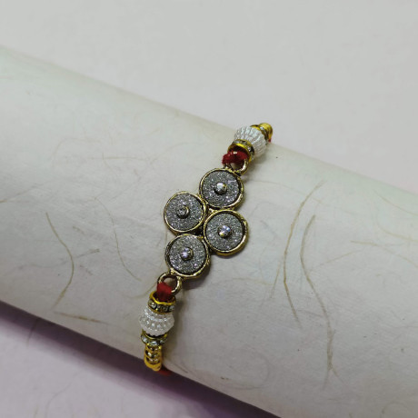 Sparkling AD Rakhi with Pearls and Beads