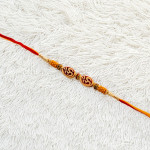 Stones and Beads Work Traditional OM Rakhi Stones and Beads Work Traditional OM Rakhi