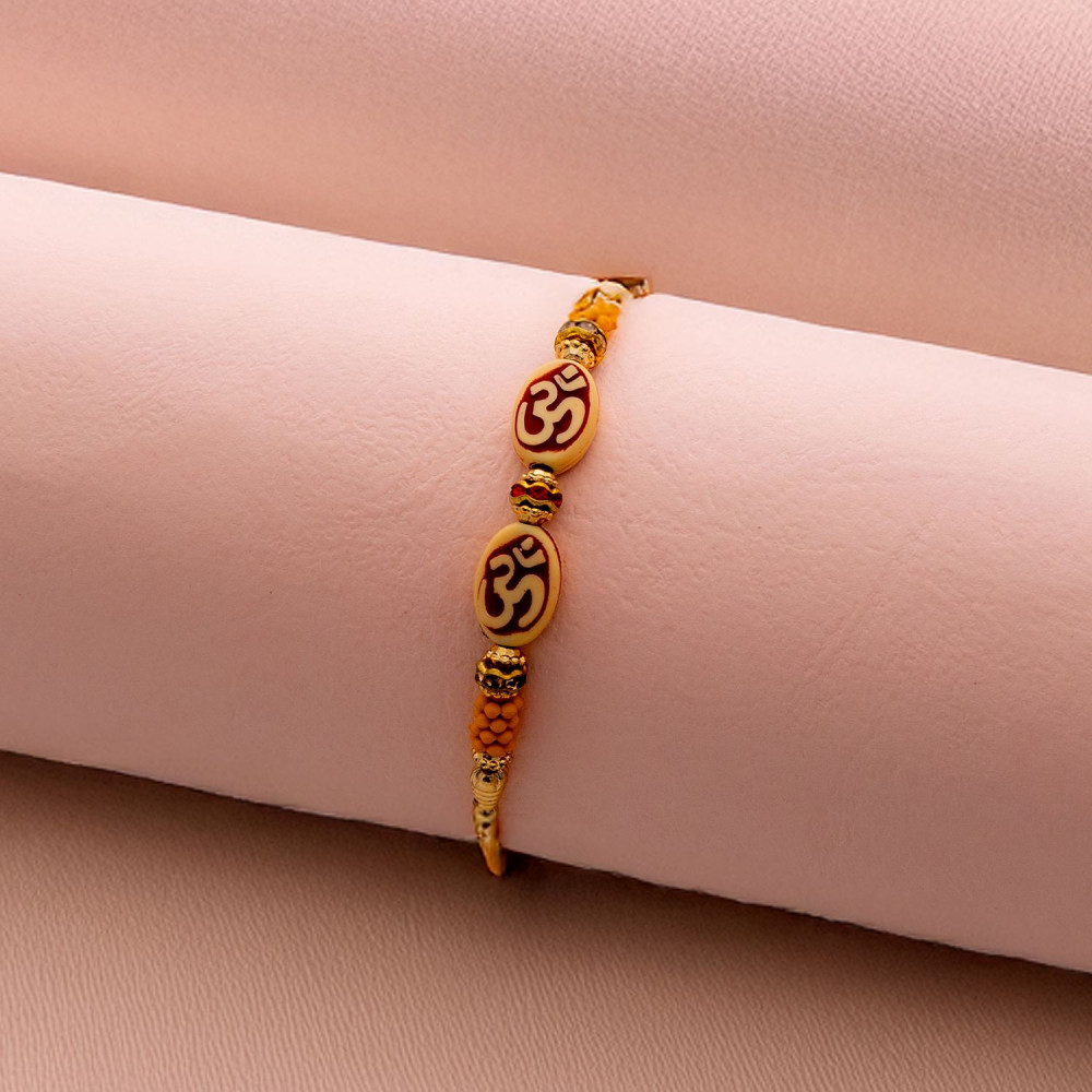 Stones and Beads Work Traditional OM Rakhi Stones and Beads Work Traditional OM Rakhi