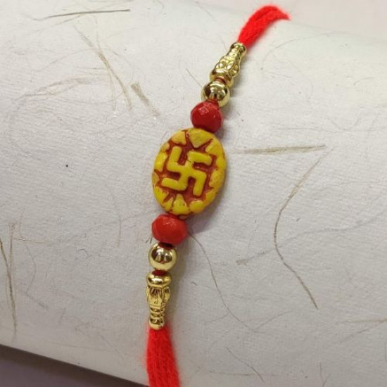 Swastika Rakhi with Red and Golden Beads