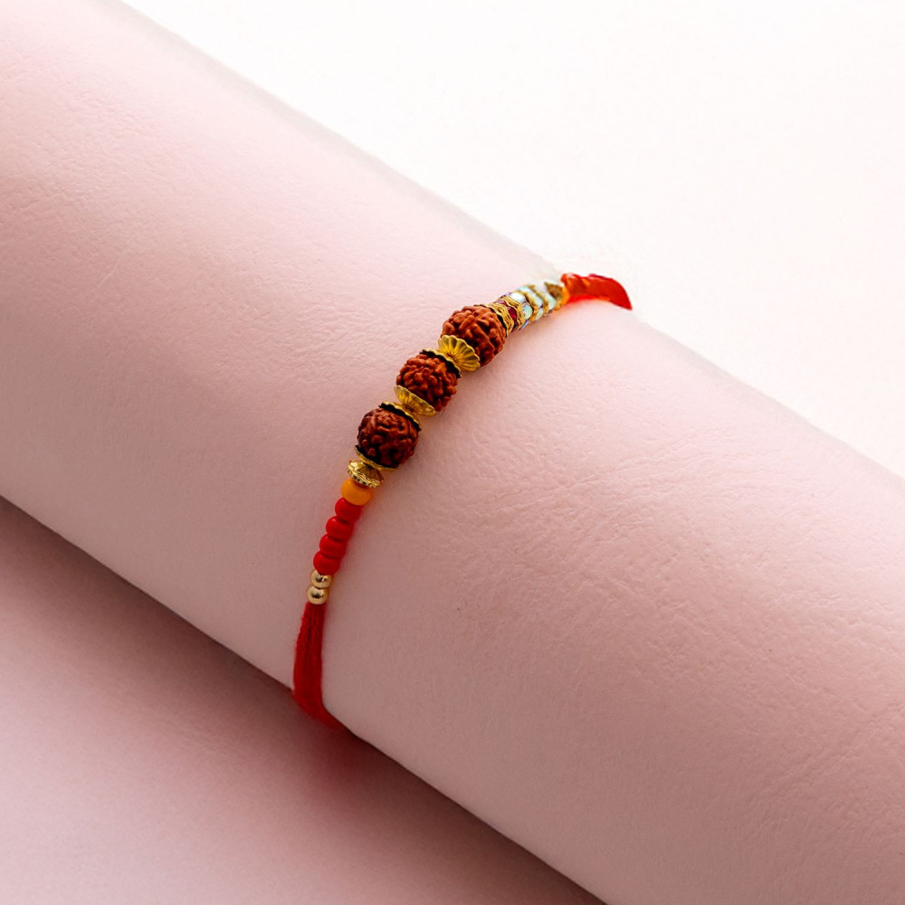 Triple Rudraksha Rakhi with Colorful Beads Triple Rudraksha Rakhi with Colorful Beads